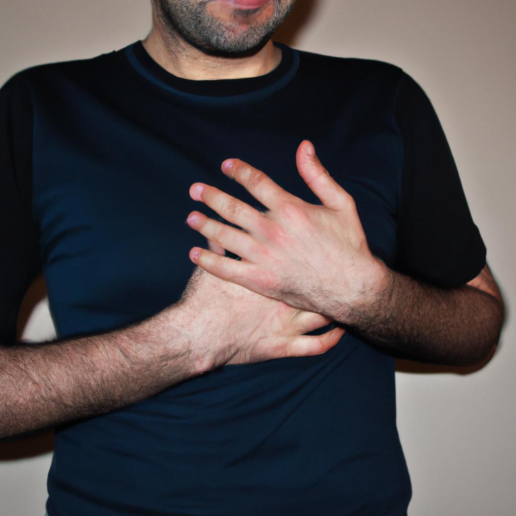 Person holding their chest in pain