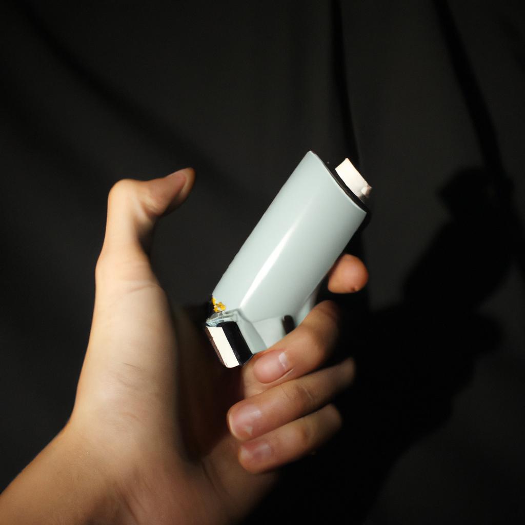 Person holding an inhaler